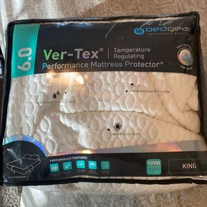 Like new King size temperature regulating mattress protector from Furniture Row